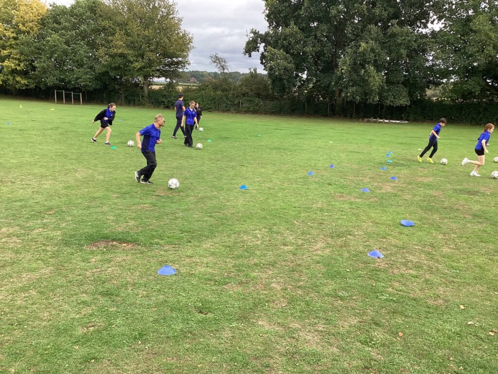 Woolpit Primary Academy boys playing football
